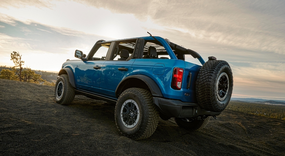 A blue 2025 Ford Bronco for sale off-roading.