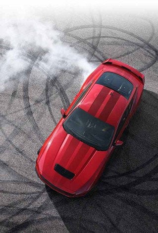 Overhead view of a 2024 Ford Mustang® model with tire tracks on pavement | Lupient Ford in Baldwin WI