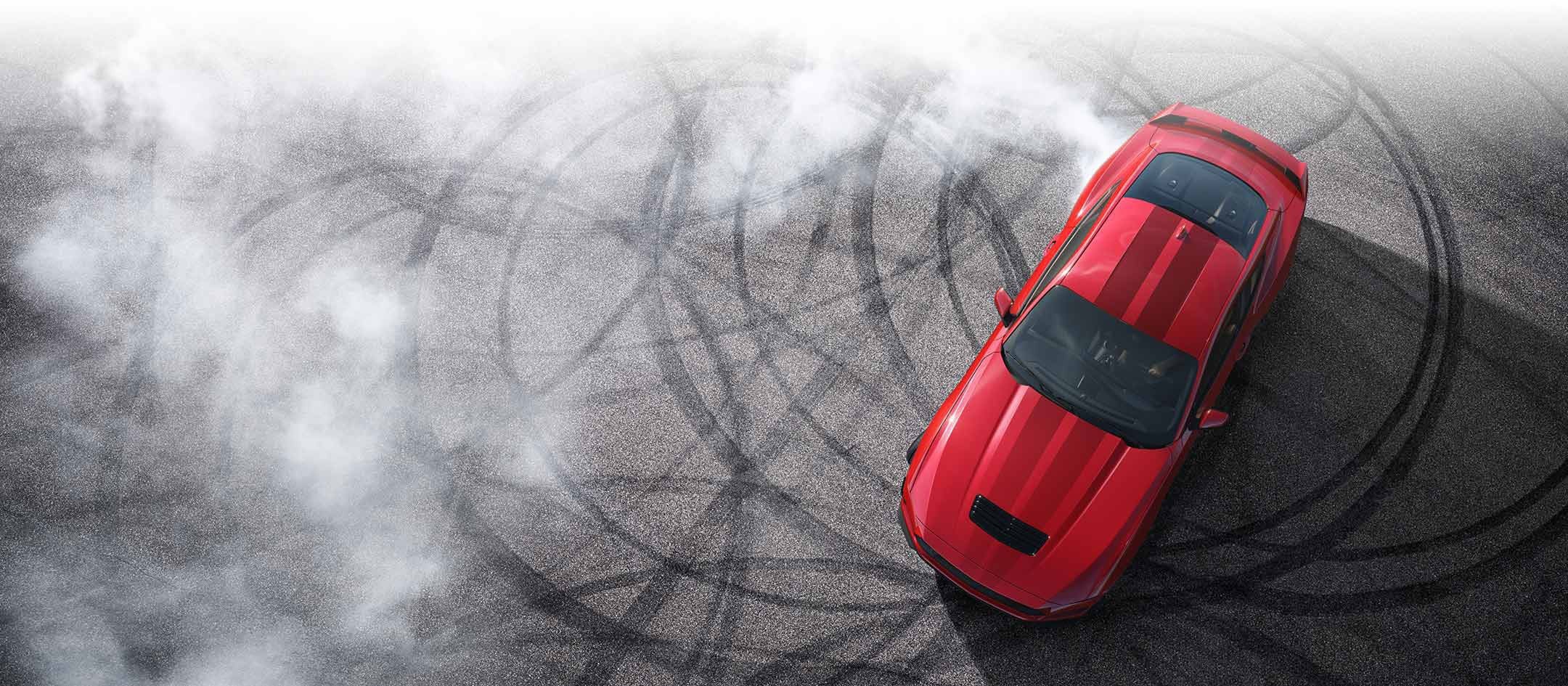 Overhead view of a 2024 Ford Mustang® model with tire tracks on pavement | Lupient Ford in Baldwin WI