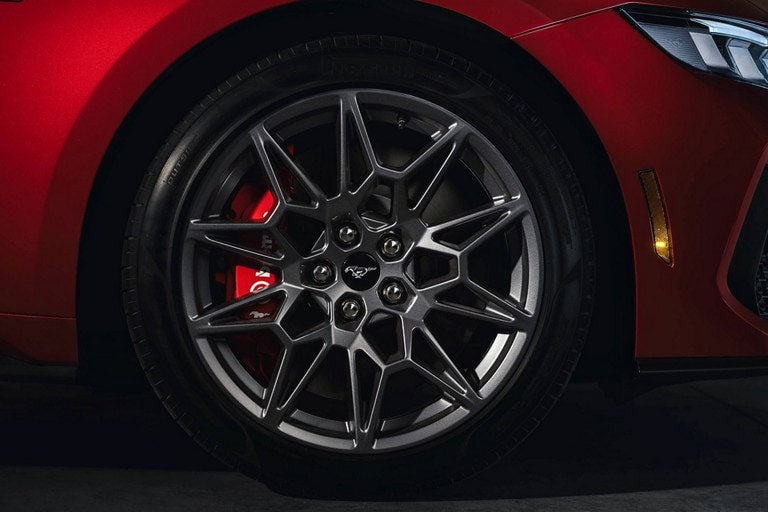 2024 Ford Mustang® model with a close-up of a wheel and brake caliper | Lupient Ford in Baldwin WI