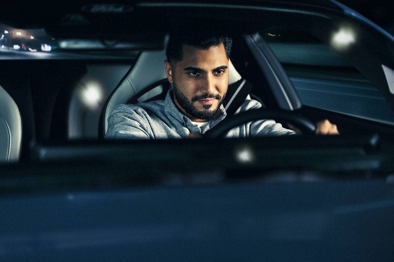 Person sitting in the driver’s seat of a parked 2024 Ford Mustang® coupe | Lupient Ford in Baldwin WI