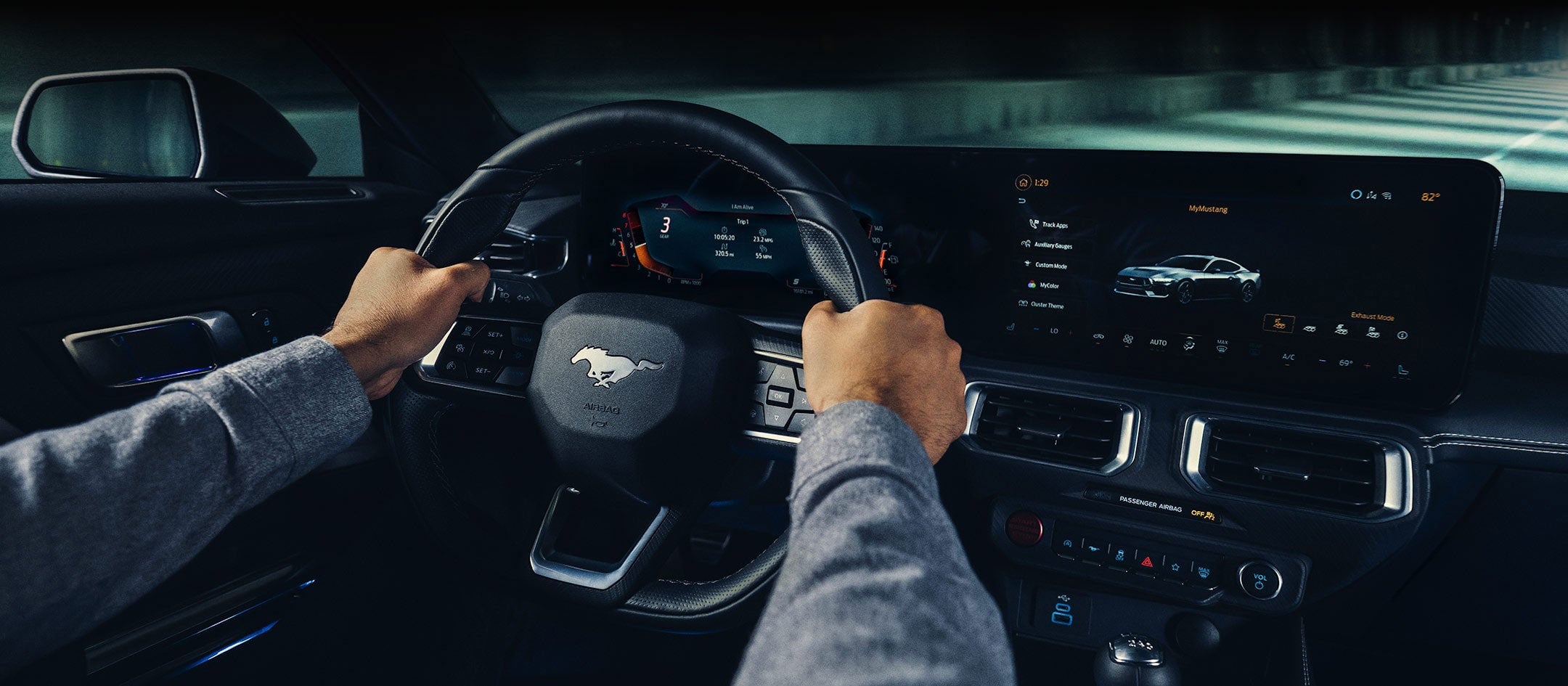 A 2024 Ford Mustang® model interior with a person driving | Lupient Ford in Baldwin WI