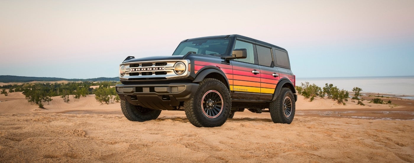 A grey 2025 Ford Bronco Free Wheeling is shown from the front at an angle.
