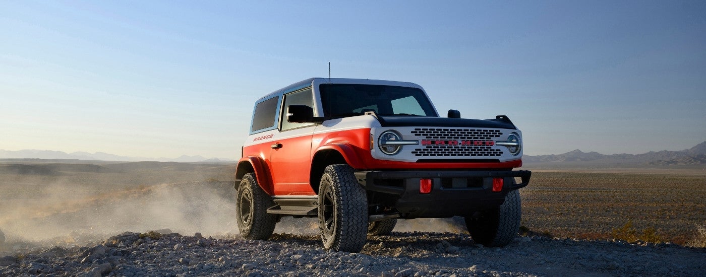 A red 2025 Ford Bronco Stroppe Edition is shown from the front at an angle.