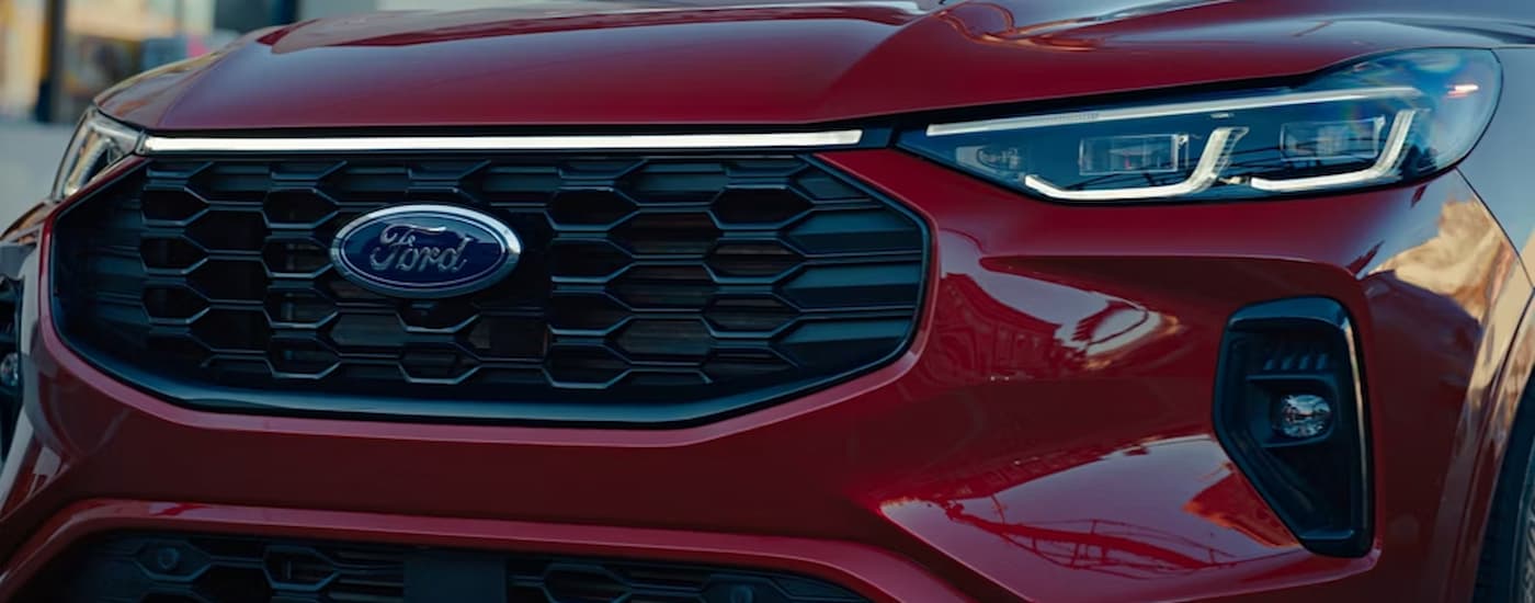 Grille and headlights on a red 2026 Ford Escape