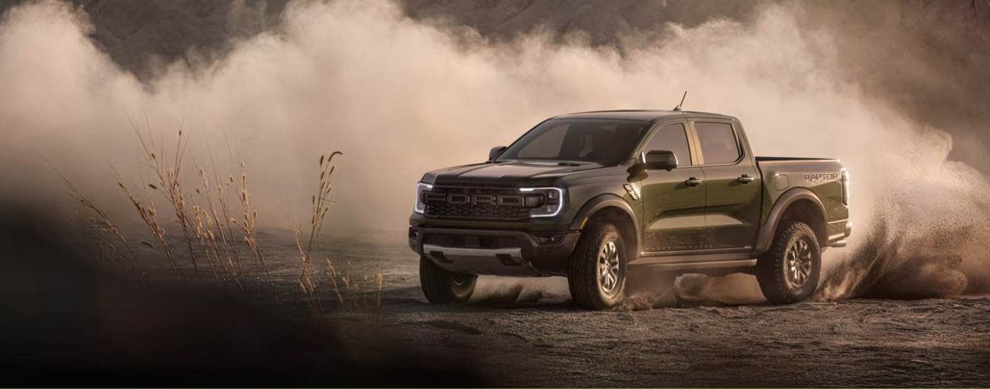 Black 2026 Ford Ranger Raptor drifting off road