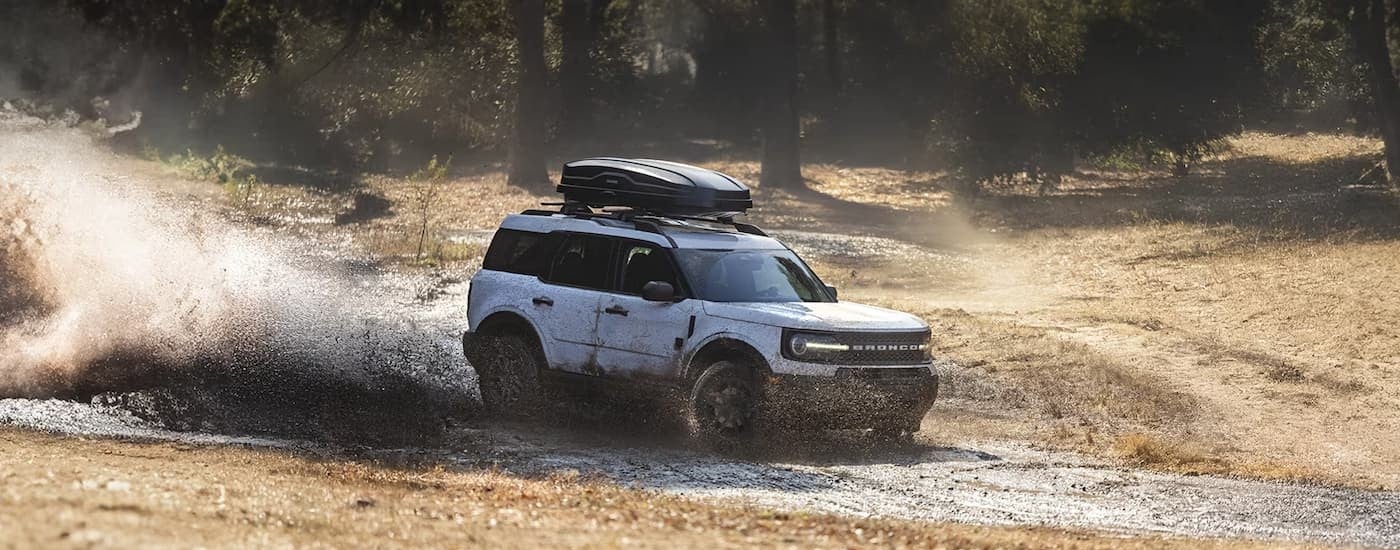 A white 2025 Ford Bronco Sport Big Bend off-roading.