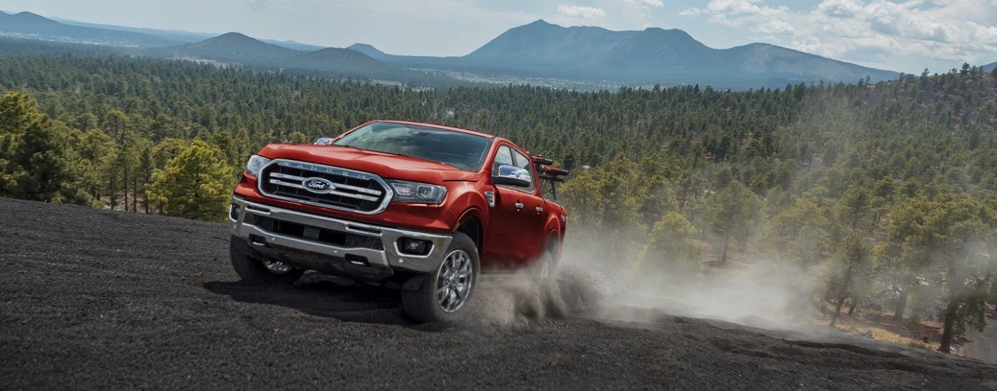 A red 2019 Ford Ranger is shown off-road.