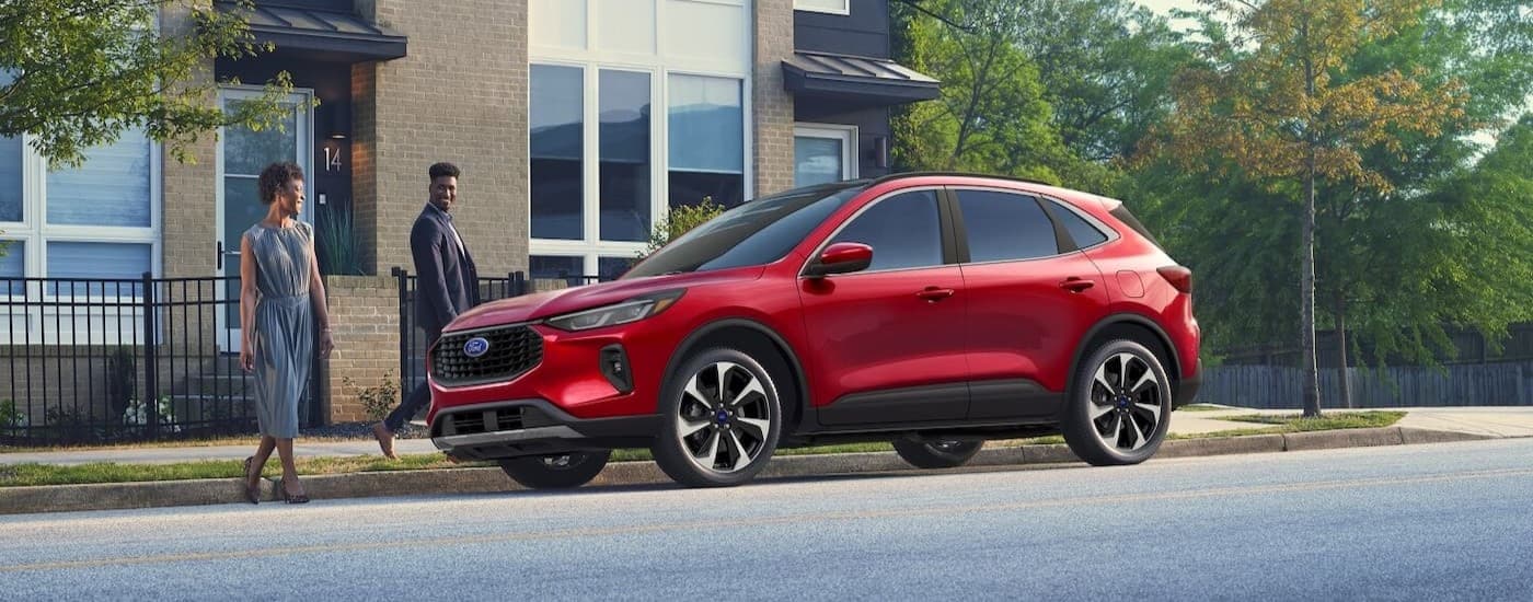 A red 2025 Ford Escape parked near a Ford dealer Oakdale.