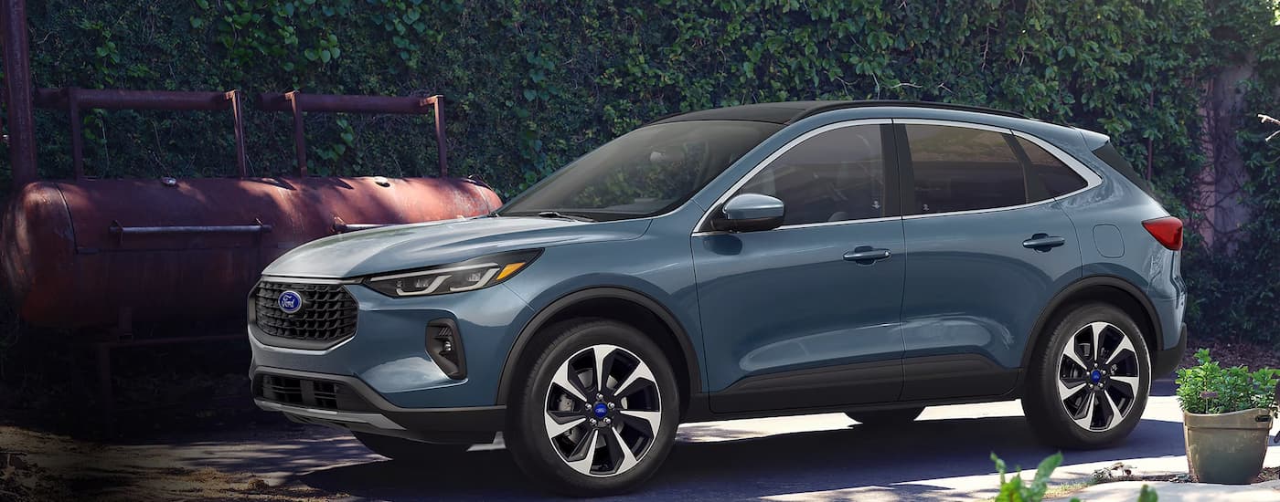 A blue 2025 Ford Escape parked off-road for sale