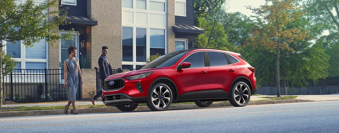 A red 2025 Ford Escape parked in a city